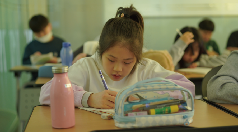 JCS Elementary Mathematics Elementary school student solving math problems in the classroom during a regular curriculum math class